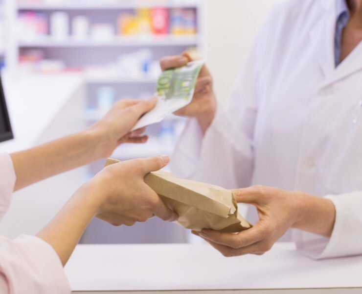 pharmacist-giving-medicine-to-costumer-at-pharmacy-2026-04-13-23-32-05-utc